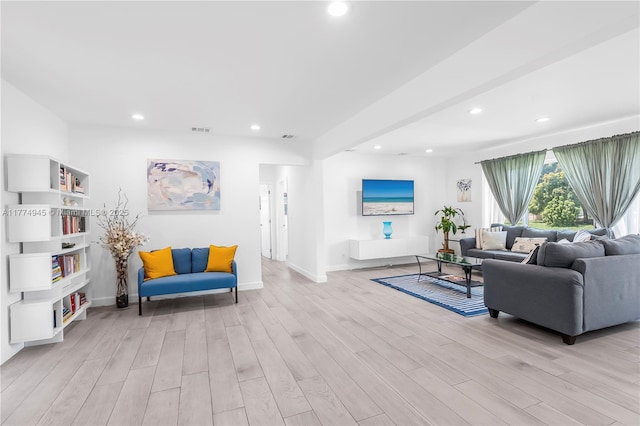 11215 NE 4th Ave, Miami, FL 33161 - living room featuring light wood finished floors and recessed lighting