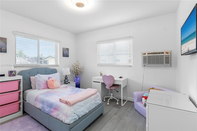 11215 NE 4th Ave, Miami, FL 33161 - bedroom featuring light wood-style floors and a wall unit AC