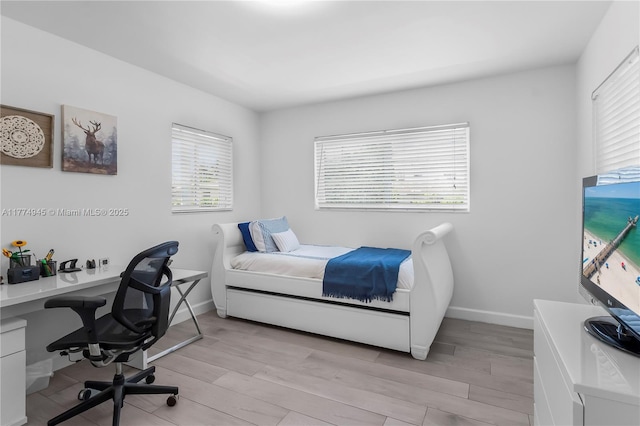 11215 NE 4th Ave, Miami, FL 33161 - bedroom featuring an office area and light wood-style floors