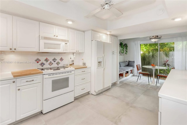 4901 SW 71st Pl Unit 4901, Miami, FL 33155 - kitchen featuring white cabinets, light countertops, white appliances, and a ceiling fan