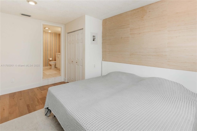 4901 SW 71st Pl Unit 4901, Miami, FL 33155 - bedroom with wood finished floors, a closet, baseboards, visible vents, and recessed lighting