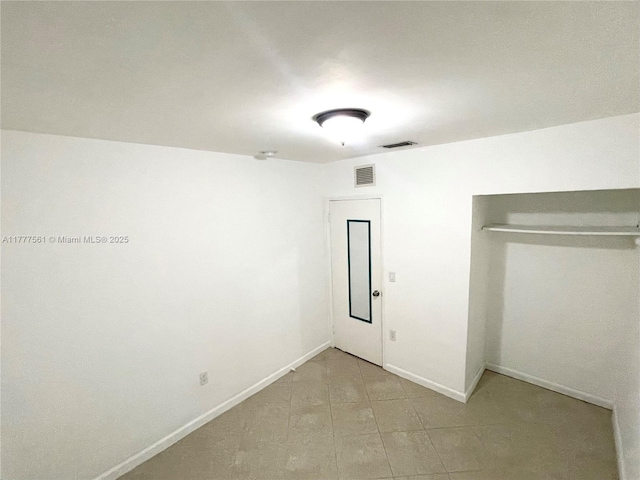 4441 SW 33rd Dr, West Park, FL 33023 - unfurnished bedroom with baseboards and light tile patterned flooring