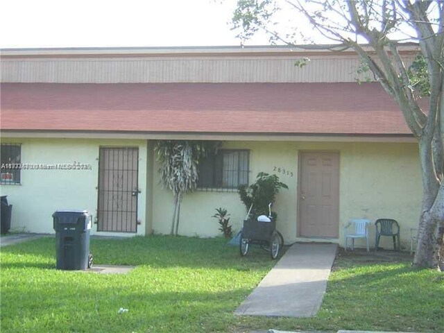 28315 SW 141st Pl Unit 28315, Homestead, FL 33033 - view of front of home featuring a front lawn and stucco siding