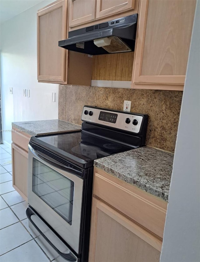 28315 SW 141st Pl Unit 28315, Homestead, FL 33033 - kitchen featuring stainless steel range with electric stovetop, under cabinet range hood, light brown cabinetry, and tasteful backsplash