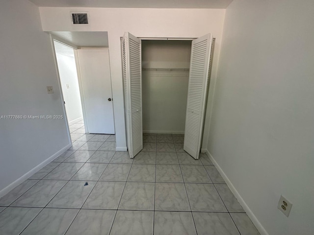 28315 SW 141st Pl Unit 28315, Homestead, FL 33033 - unfurnished bedroom featuring a closet and baseboards