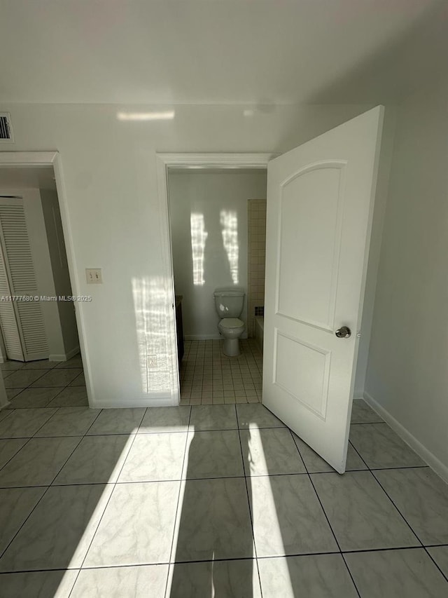 28315 SW 141st Pl Unit 28315, Homestead, FL 33033 - unfurnished bedroom with light tile patterned floors and baseboards