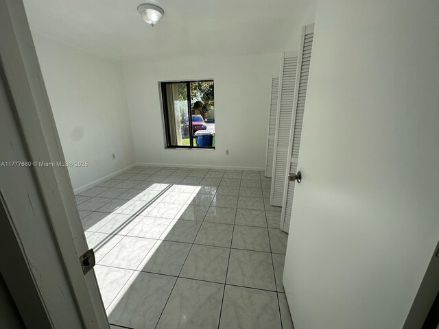 28315 SW 141st Pl Unit 28315, Homestead, FL 33033 - tiled spare room with baseboards