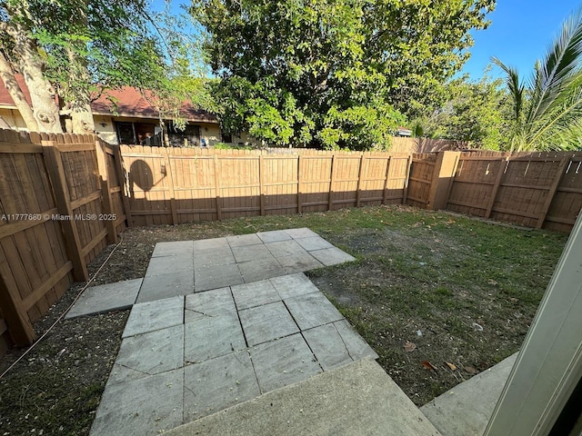 28315 SW 141st Pl Unit 28315, Homestead, FL 33033 - fenced backyard featuring a patio area