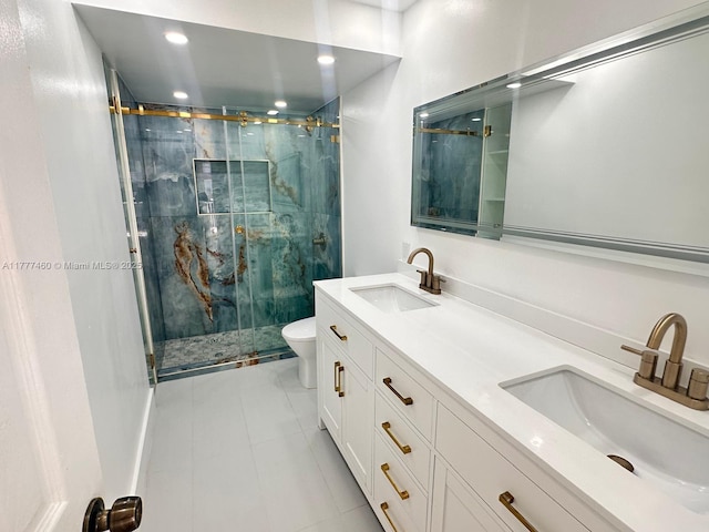 bathroom featuring tile patterned floors, a sink, a stall shower, and toilet