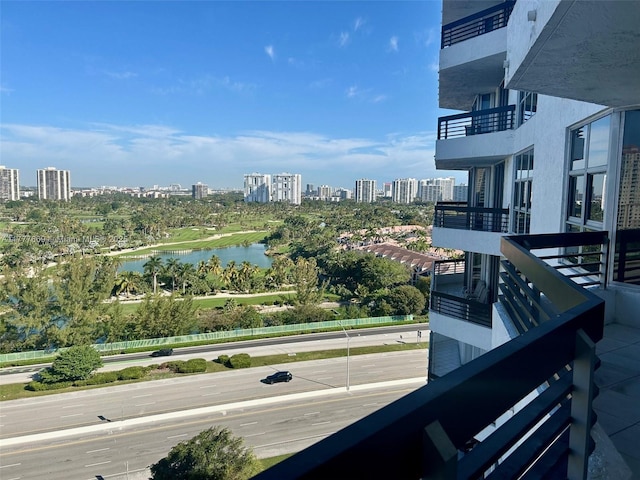 balcony featuring a water view and a view of city