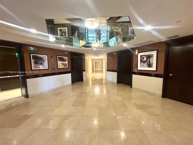 building lobby featuring visible vents