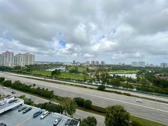 bird's eye view featuring a water view and a view of city