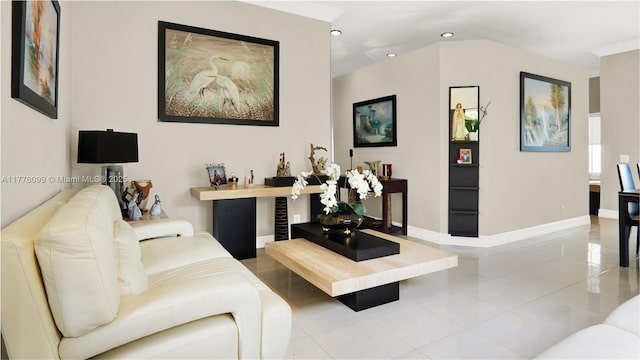 tiled living room featuring baseboards and recessed lighting