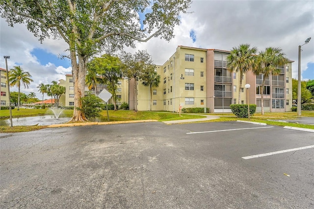 1820 SW 81st Ave Unit 3300, North Lauderdale, FL 33068 - view of building exterior featuring uncovered parking