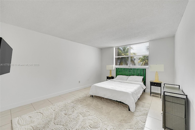 1820 SW 81st Ave Unit 3300, North Lauderdale, FL 33068 - bedroom featuring light tile patterned floors, a textured ceiling, and baseboards