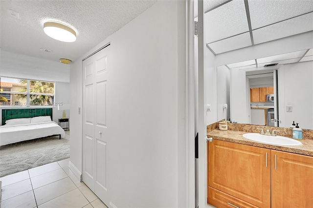 1820 SW 81st Ave Unit 3300, North Lauderdale, FL 33068 - bathroom featuring tile patterned floors, vanity, and a textured ceiling
