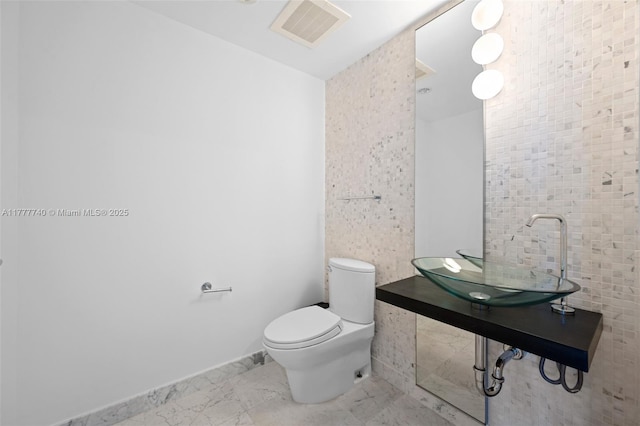200 Biscayne Blvd Way Unit 4311, Miami, FL 33131 - bathroom with marble finish floor, visible vents, toilet, and a sink
