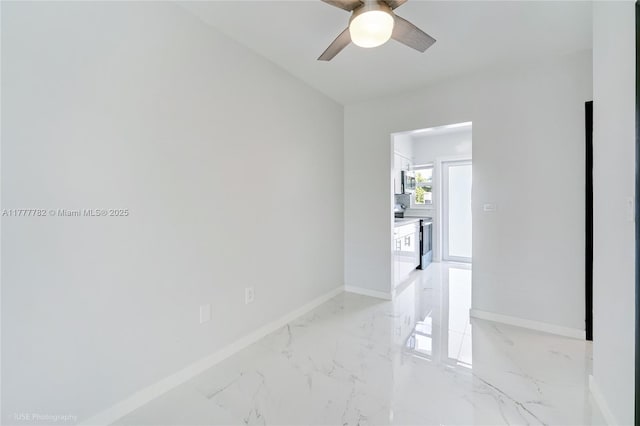 641 Espanola Way Unit 35, Miami Beach, FL 33139 - unfurnished room with a ceiling fan, light marble finish floors, and baseboards