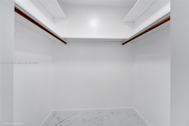 641 Espanola Way Unit 35, Miami Beach, FL 33139 - walk in closet featuring marble finish floors