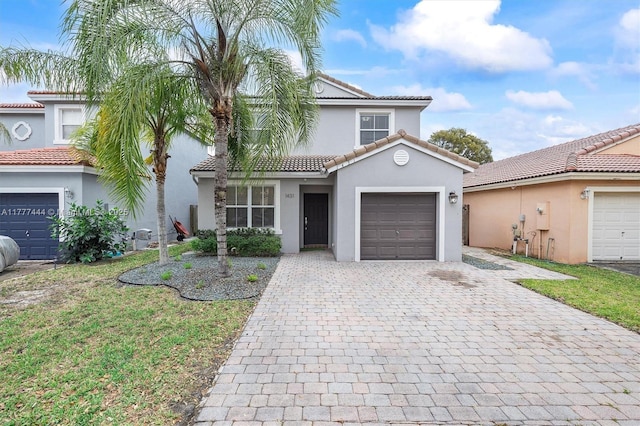 1431 SE 18th Ter, Homestead, FL 33035 - mediterranean / spanish house with decorative driveway, stucco siding, and a tiled roof