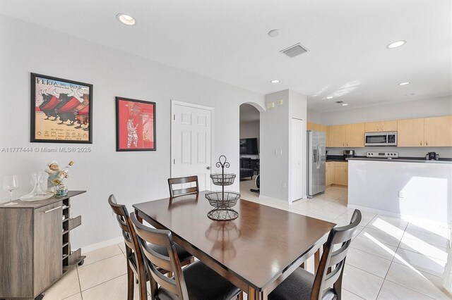 1431 SE 18th Ter, Homestead, FL 33035 - dining area with light tile patterned floors, baseboards, visible vents, arched walkways, and recessed lighting