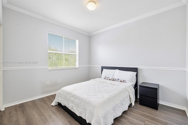 1431 SE 18th Ter, Homestead, FL 33035 - bedroom featuring baseboards, crown molding, and wood finished floors