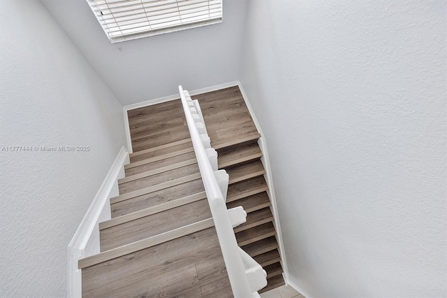 1431 SE 18th Ter, Homestead, FL 33035 - stairs featuring a textured wall and wood finished floors