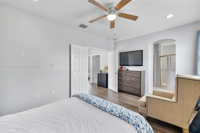 1431 SE 18th Ter, Homestead, FL 33035 - bedroom with dark wood-style floors, visible vents, arched walkways, ceiling fan, and recessed lighting
