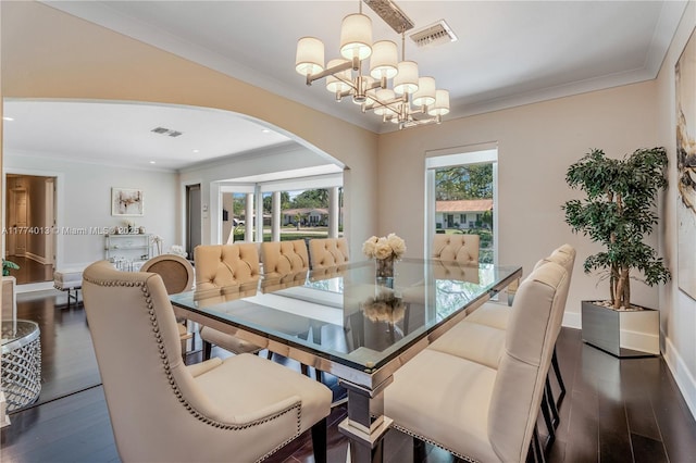 7465 SW 159th Ter, Palmetto Bay, FL 33157 - dining room featuring crown molding, a chandelier, visible vents, arched walkways, and dark wood-style flooring