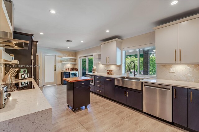 7465 SW 159th Ter, Palmetto Bay, FL 33157 - kitchen with a sink, open shelves, white cabinetry, dishwasher, and wooden counters