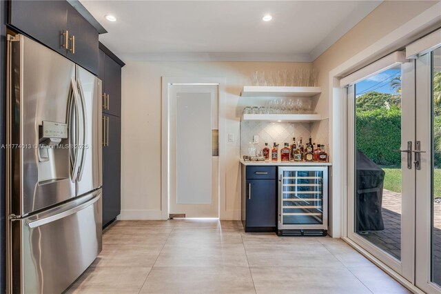 7465 SW 159th Ter, Palmetto Bay, FL 33157 - bar featuring wine cooler, a bar, tasteful backsplash, stainless steel refrigerator with ice dispenser, and recessed lighting
