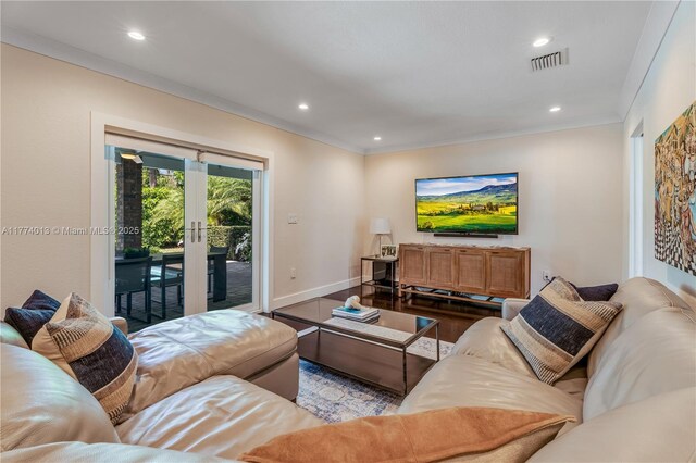 7465 SW 159th Ter, Palmetto Bay, FL 33157 - living room featuring crown molding, french doors, wood finished floors, baseboards, and recessed lighting