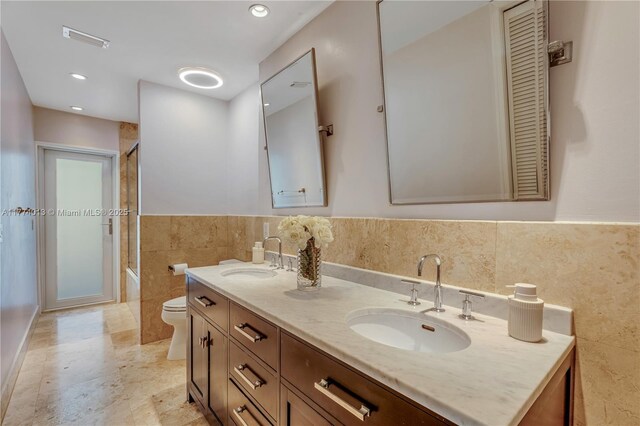 7465 SW 159th Ter, Palmetto Bay, FL 33157 - bathroom featuring tile walls, recessed lighting, double vanity, and a sink