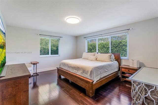 7465 SW 159th Ter, Palmetto Bay, FL 33157 - bedroom with multiple windows, wood finished floors, and baseboards