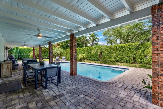 7465 SW 159th Ter, Palmetto Bay, FL 33157 - view of swimming pool with ceiling fan, outdoor dining area, a fenced in pool, and a patio area