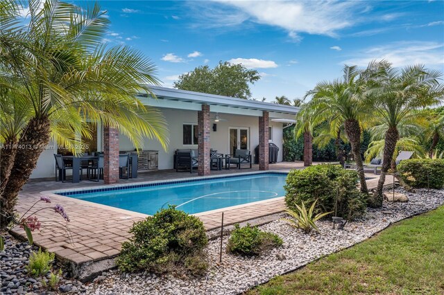 7465 SW 159th Ter, Palmetto Bay, FL 33157 - outdoor pool featuring a patio area and a ceiling fan