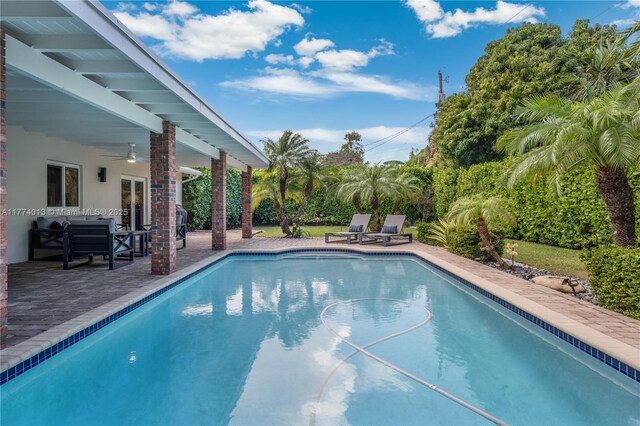 7465 SW 159th Ter, Palmetto Bay, FL 33157 - outdoor pool featuring ceiling fan, french doors, and a patio area