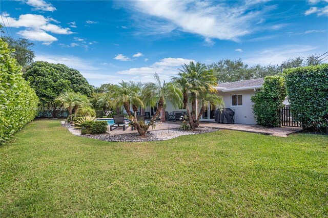 7465 SW 159th Ter, Palmetto Bay, FL 33157 - view of yard featuring a fenced backyard and a patio area