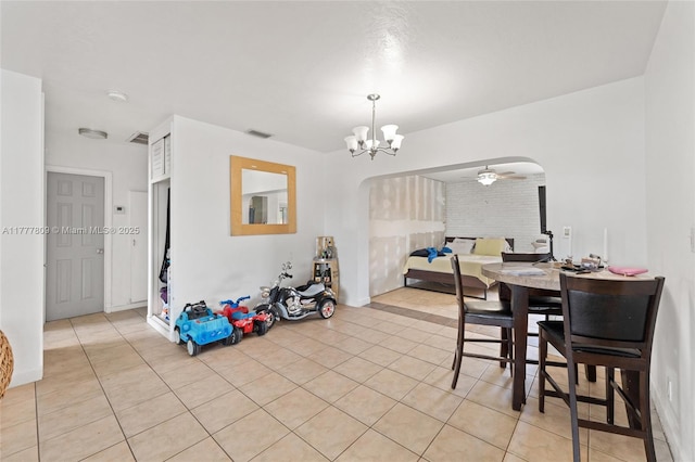 6930 SW 5th St, Pembroke Pines, FL 33023 - dining room with arched walkways, a ceiling fan, light tile patterned floors, and a chandelier