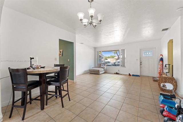 6930 SW 5th St, Pembroke Pines, FL 33023 - dining room featuring a chandelier, light tile patterned floors, visible vents, and baseboards