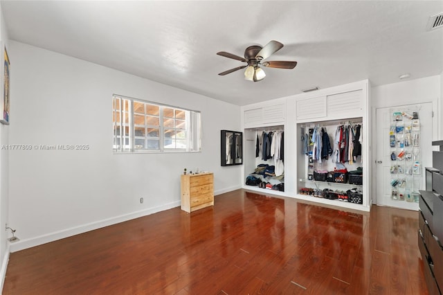 6930 SW 5th St, Pembroke Pines, FL 33023 - unfurnished bedroom featuring baseboards, ceiling fan, visible vents, two closets, and wood finished floors