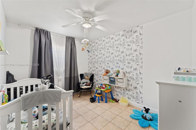 6930 SW 5th St, Pembroke Pines, FL 33023 - tiled bedroom with a crib, wallpapered walls, ceiling fan, and an accent wall