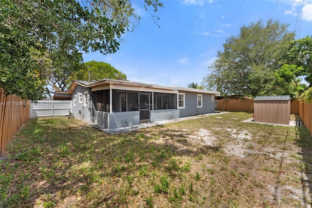6930 SW 5th St, Pembroke Pines, FL 33023 - back of property with a sunroom, a fenced backyard, and a storage shed