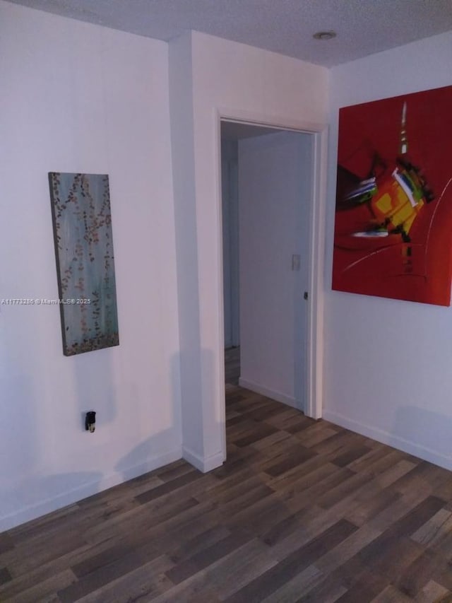 19901 E Country Club Dr Unit 2305, Aventura, FL 33180 - empty room featuring baseboards, a textured ceiling, and wood finished floors