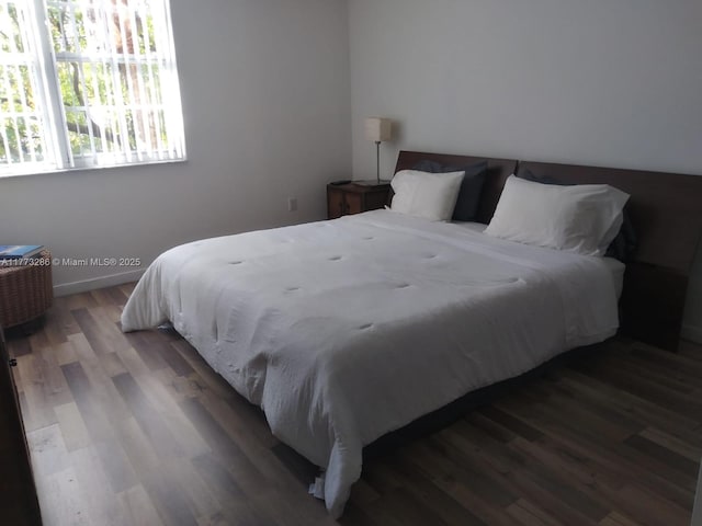 19901 E Country Club Dr Unit 2305, Aventura, FL 33180 - bedroom featuring baseboards and wood finished floors
