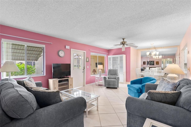 336 Pine Ridge Cir Unit B-1, Green Acres, FL 33463 - living room featuring ceiling fan with notable chandelier, light tile patterned flooring, and a textured ceiling