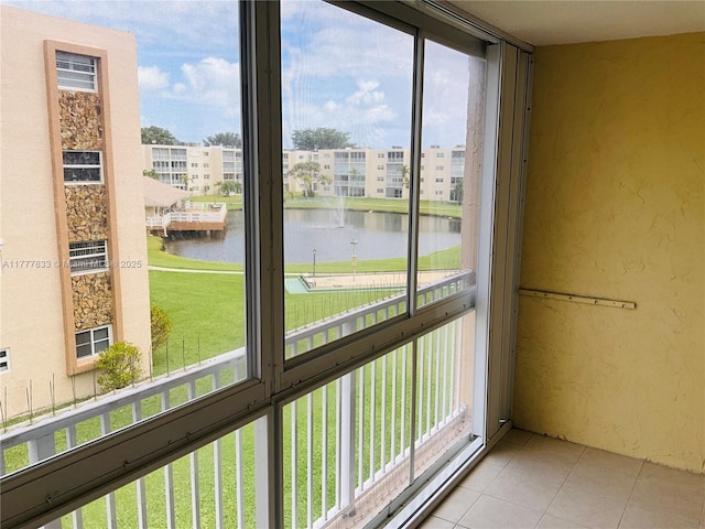interior space featuring a water view and a healthy amount of sunlight