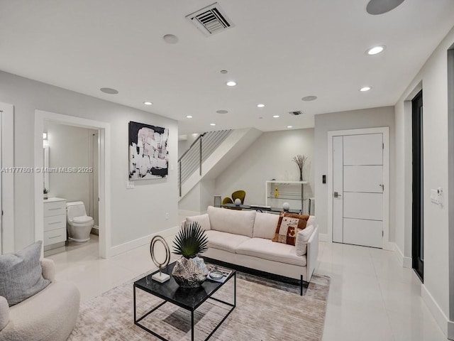 living room with recessed lighting, baseboards, stairs, and visible vents