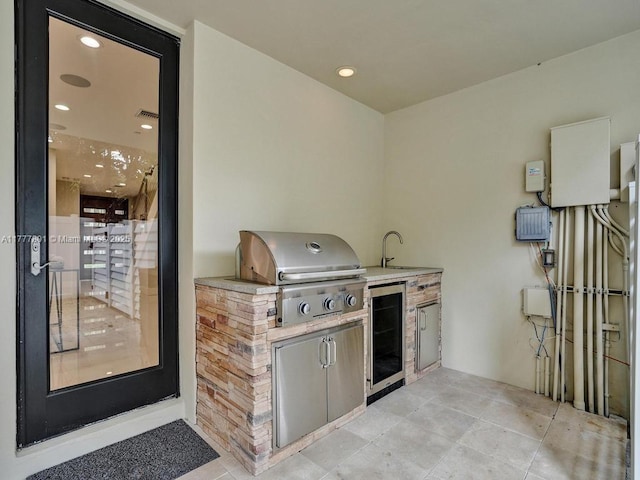view of patio / terrace featuring exterior kitchen and grilling area