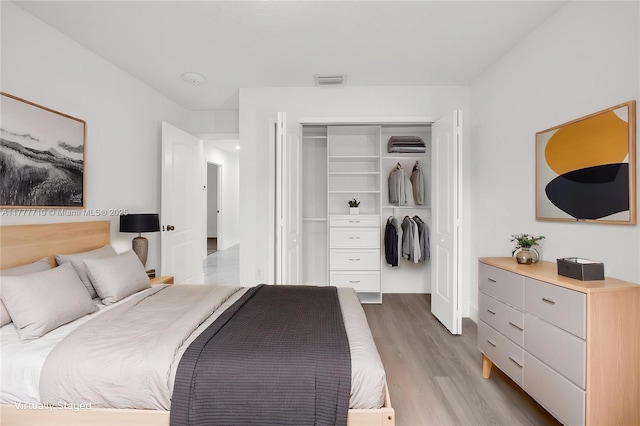 17663 SW 5th St, Pembroke Pines, FL 33029 - bedroom with visible vents, wood finished floors, and a closet